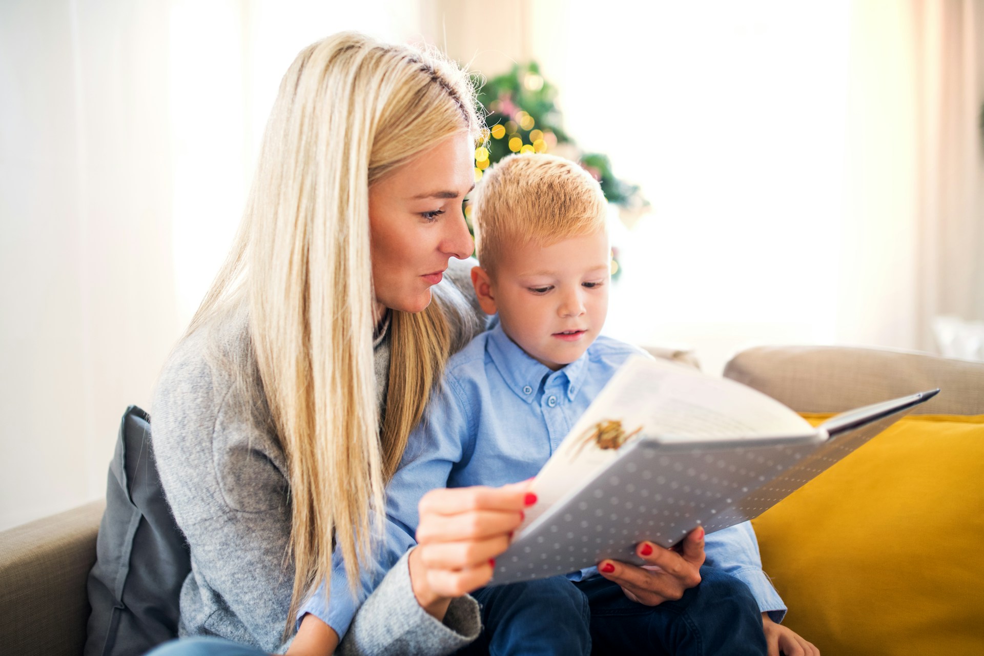 mom and kid reading book
